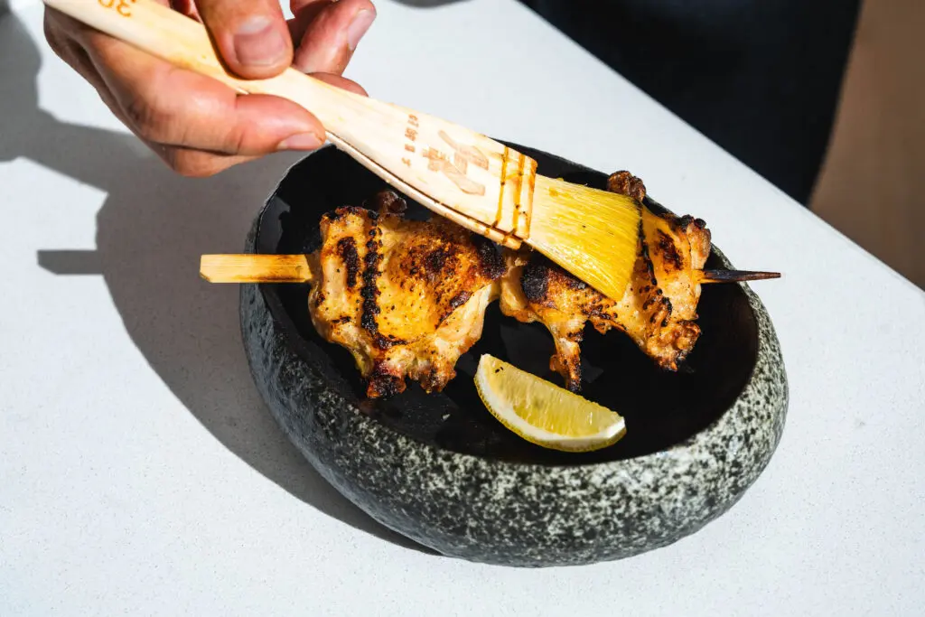 Serving a balance of sushi and cooked food, yakitori, the latter is prepared with as much meticulous care as the former, with ingredients subject to an array of flavor-boosting techniques, from bringing to dry rubs to fermenting before meats and vegetables are grilled over a live fire. (Photo by Photos by Studio Rivera)