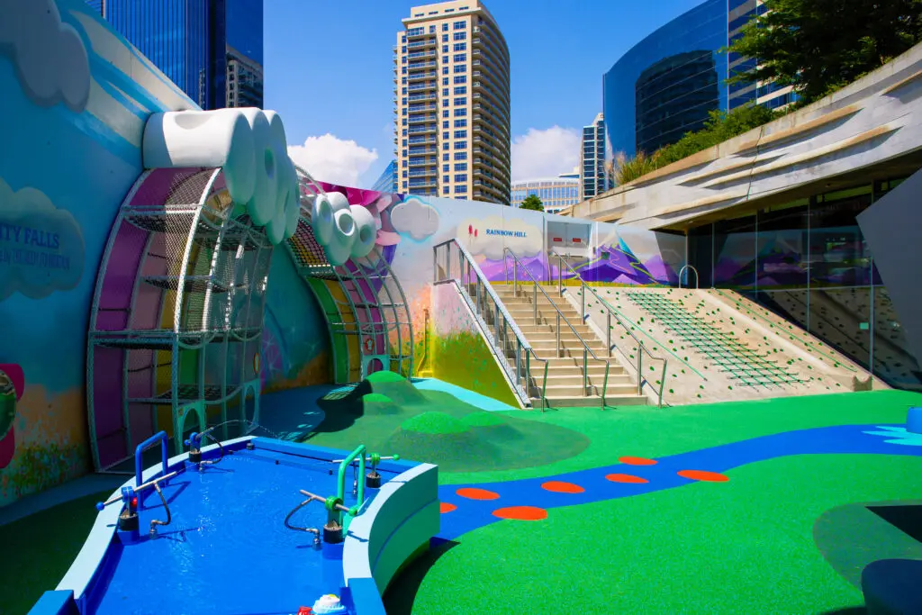 The enlarged outdoor area features a programmable waterfall and organic play elements that encourage exploration. (Photo by John Smith)