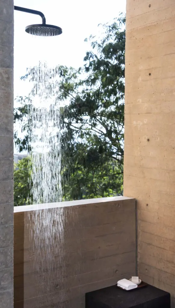 The outdoor showers in Four Seasons Tamarindo's suites epitomize the property's seamless integration with its lush jungle and clifftop setting. (Photo by Four Seasons Tamarindo)