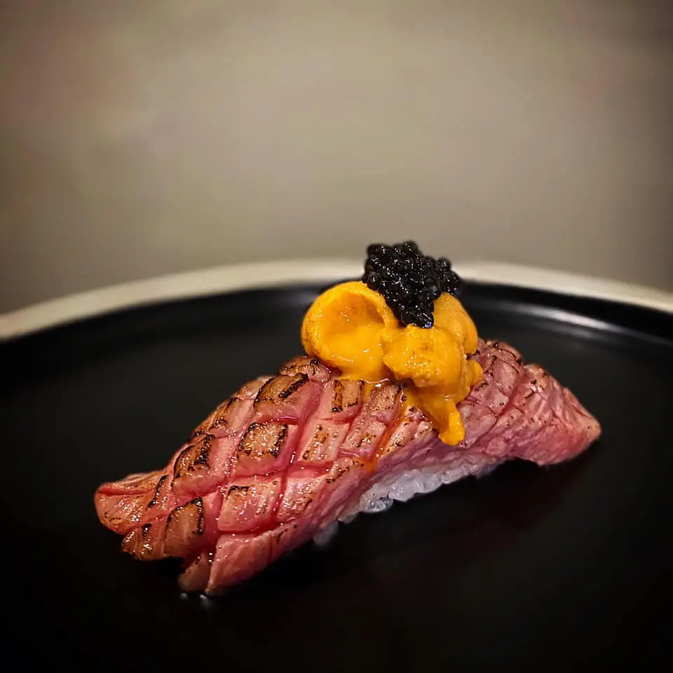 Hatsuyuki Handroll Bar serves made-to-order temaki in a sleek, counter-style setting where crisp seaweed and fresh fish are the stars. (Courtesy)