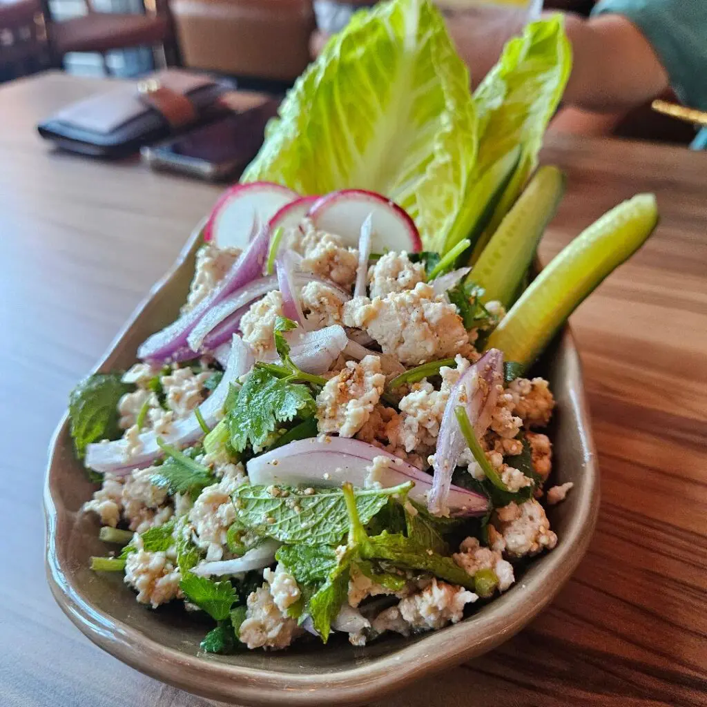 The Laab salad is light, citrusy, and herbal. (Photo by Edward Brown )