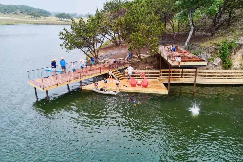 Gather with friends and family at the jumping platforms along Longhorn Lake. (Photo courtesy of Boot Ranch)