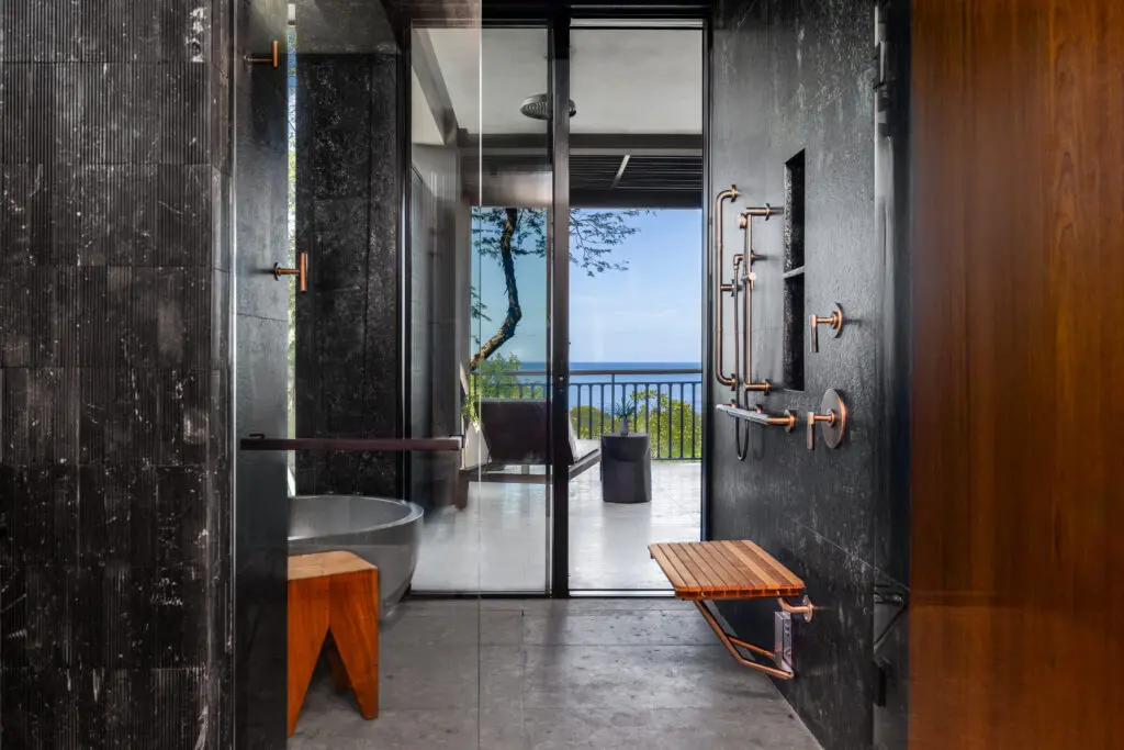 The Ocean Vista Suite includes a marble bathroom with an oversized black concrete bathtub and rain shower, double vanities, and one of the largest resort closets I’ve ever seen. (Courtesy)
