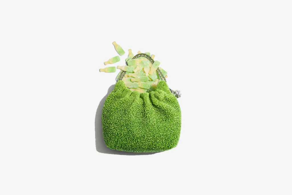 The mini Fleming hobo bag appears dipped in a “sugar” beaded coating like BonBon’s sour gummies (Courtesy of Tory Burch)