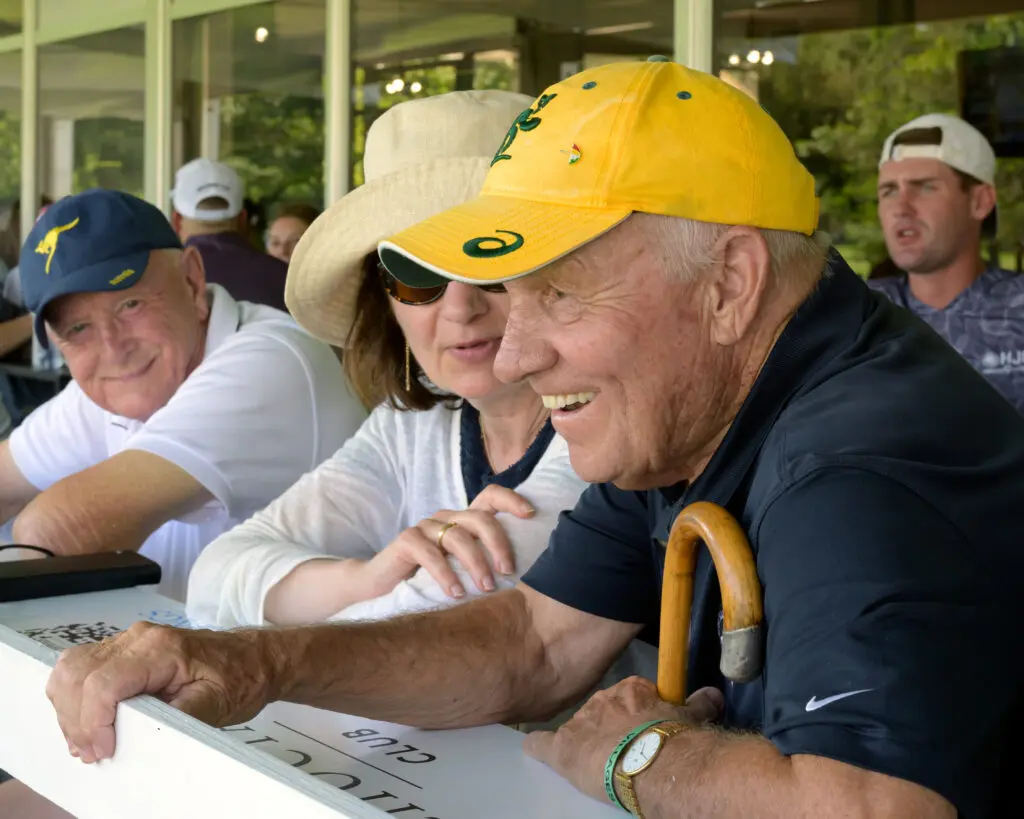 A fan shares a laugh with friends inside one of the tournament’s shaded VIP lounges, a perfect retreat from the Texas heat. (Photo by Walt Burns)
