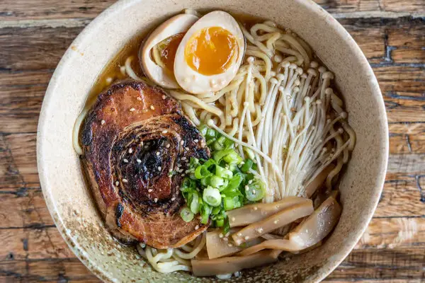 Wabi House channels izakaya culture with bold small plates and standout ramen in a relaxed, wood-toned space. (Courtesy)