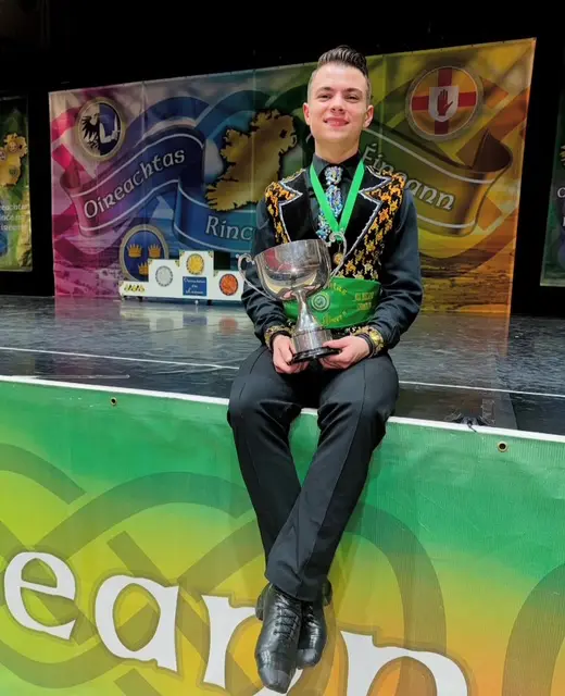 World Irish Dance Champion Michael Pixton poses with his prize in Dublin in April 2025.