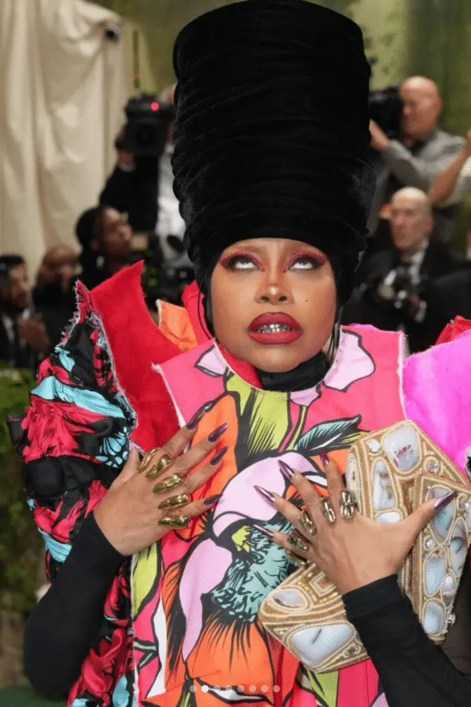 Erykah Badu wearing Comme Des Garçons SS24 and grillz by Masahiro LaMarsh at Met Gala 2024 (Courtesy @hirolamarsh on Instagram)