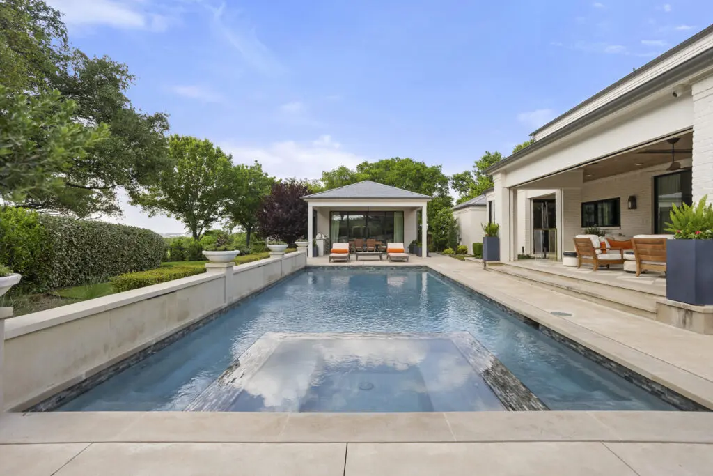 A heated pool and spa anchor the backyard, where a fully appointed guest cabana offers additional living space with panoramic golf course views. (Courtesy)
