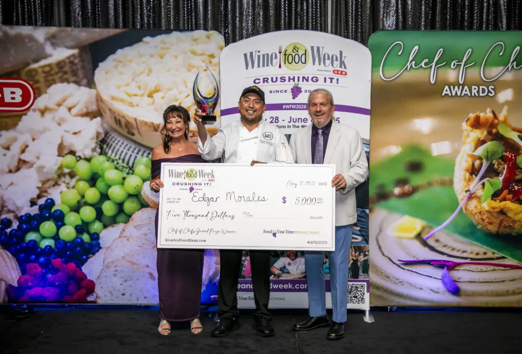 Constance and Clifton McDerby congratulate Del Frisco's Chef Edgar Morales, who won $5,000 for his creation at Wine and Food Week at The Woodlands Waterway Marriott. (Photo by Food and Vine Time Productions)