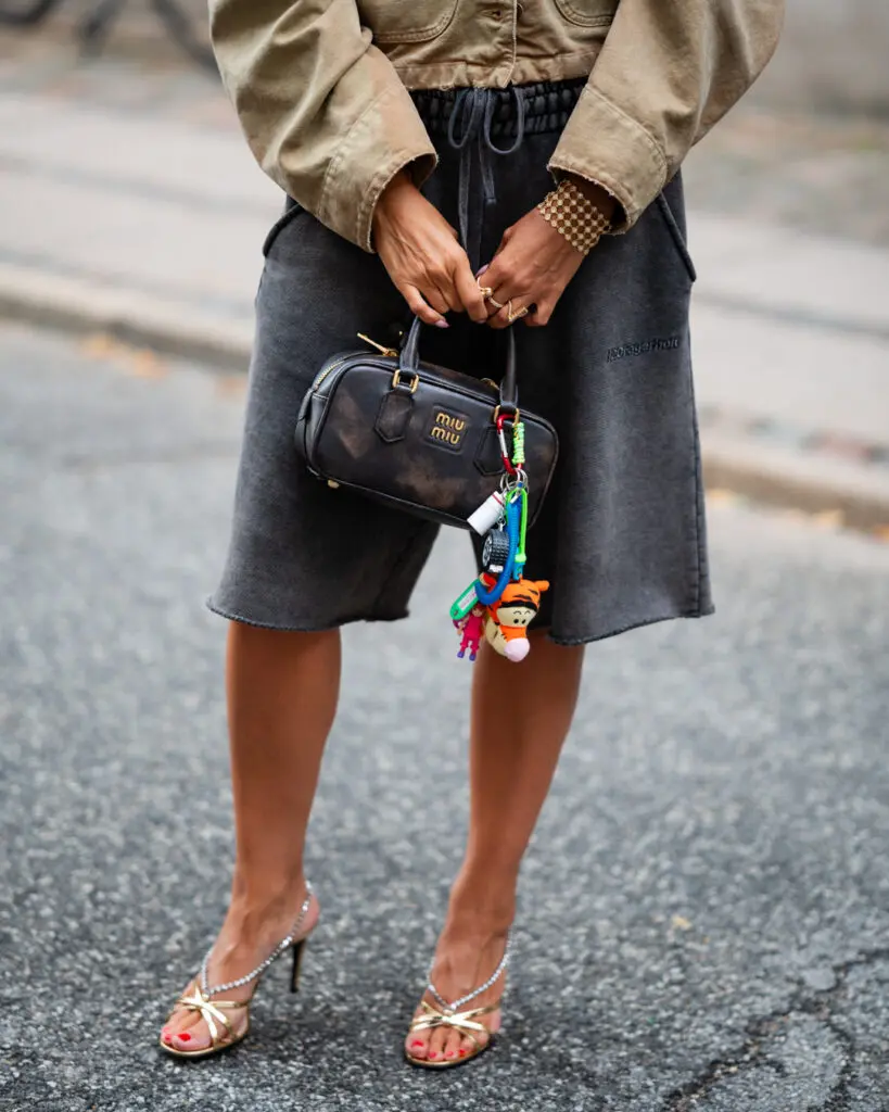 A custom order bag charm set featuring vintage Y2K McDonald’s Happy Meal Winnie the Pooh plushies and handcrafted carabiners and charms. Styled with a Miu Miu bag. Copenhagen Fashion Week 2024.  (Courtesy Amanda Marcuson)