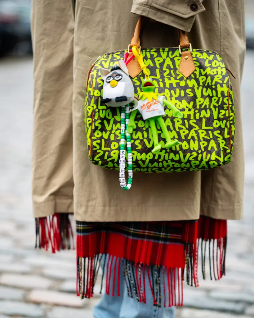 Vintage original 2001 plush Furby and Kermit the Frog plush bag charms are styled with a vintage Louis Vuitton Graffiti Stephen Sprouse Speedy. Paris Fashion Week 2025. (Courtesy Amanda Marcuson)