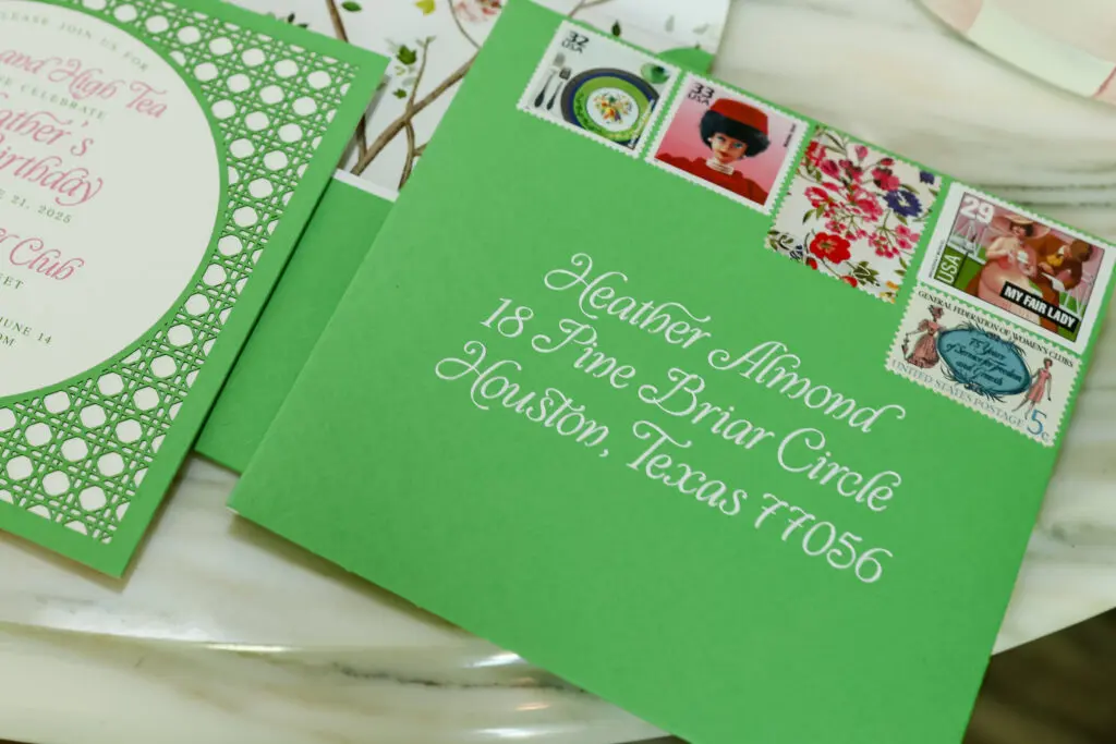 Dallas’ 5 by 7 Designs created the invitations, the menus and the beautifully curated vintage stamps. (Photo by Priscilla Dickson)