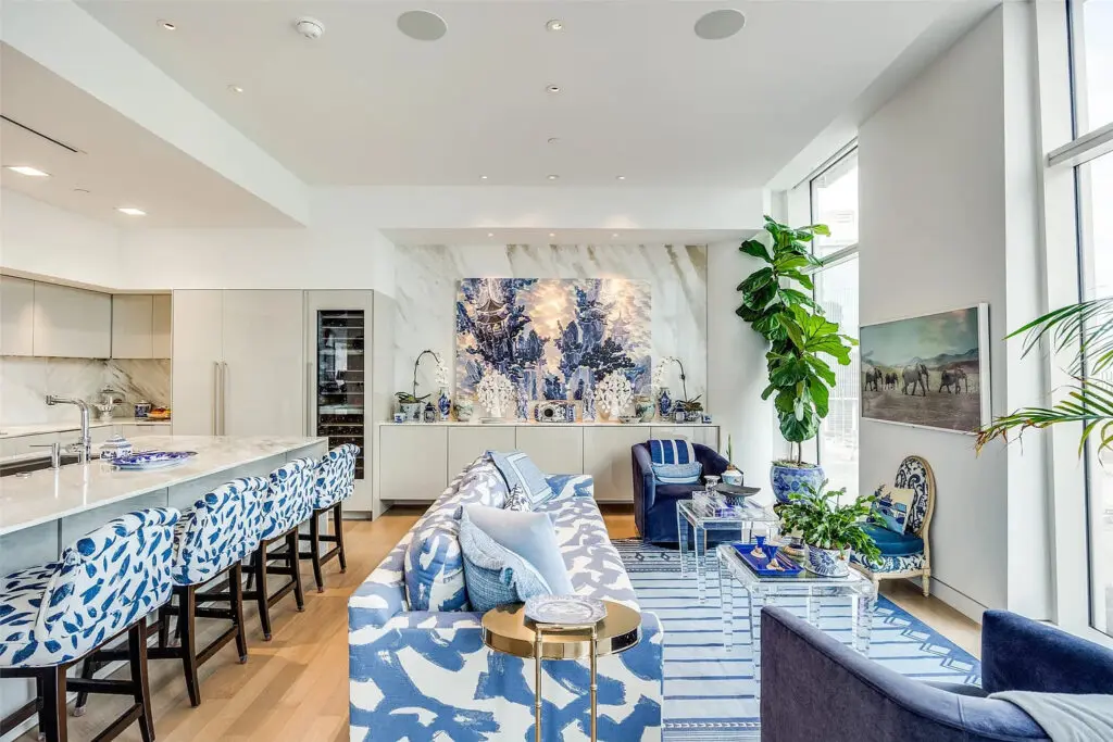 The kitchen and a seating area in the open-concept floorplan. (Photo by Compass RE Texas)
