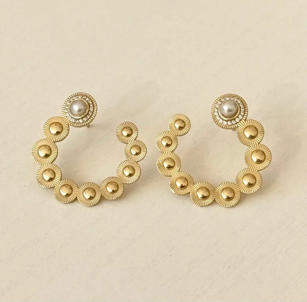 Sunbeam Crescent Pearl Earring, $2,250. 