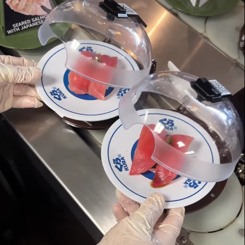 Freshly prepared plates are added to the conveyor belt straight from the kitchen. (Photo courtesy Kura Revolving Sushi Bar)