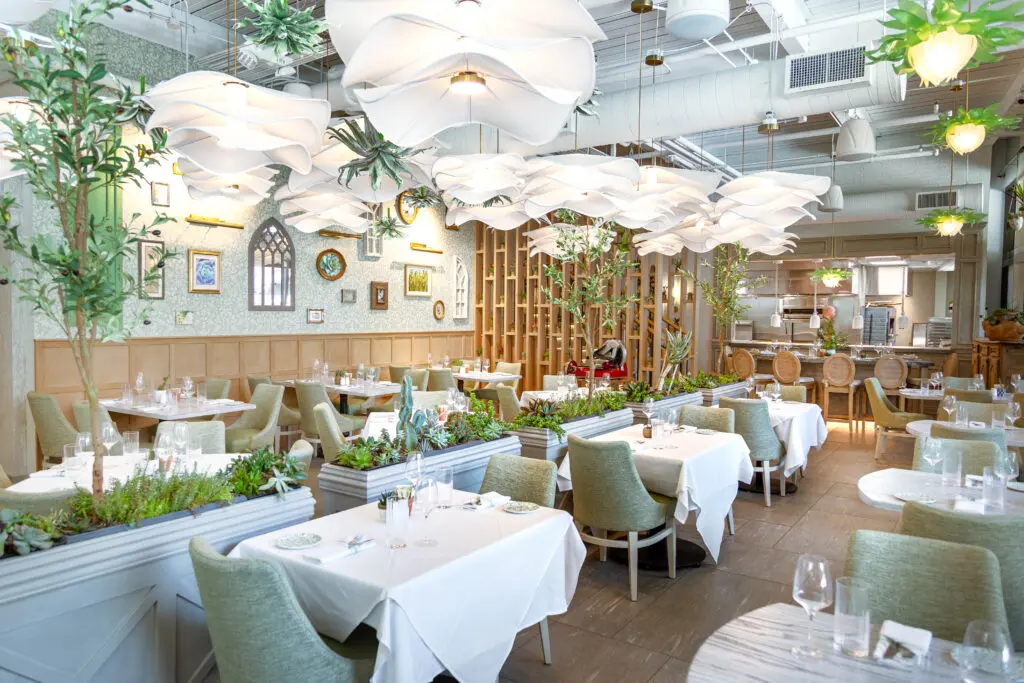 Inside Succulent, the design is meant to bring to mind a modern Napa Valley farmhouse dressed with antiques, reclaimed wood flooring, and an array of collected china patterns. (Photo by Jenn Duncan)