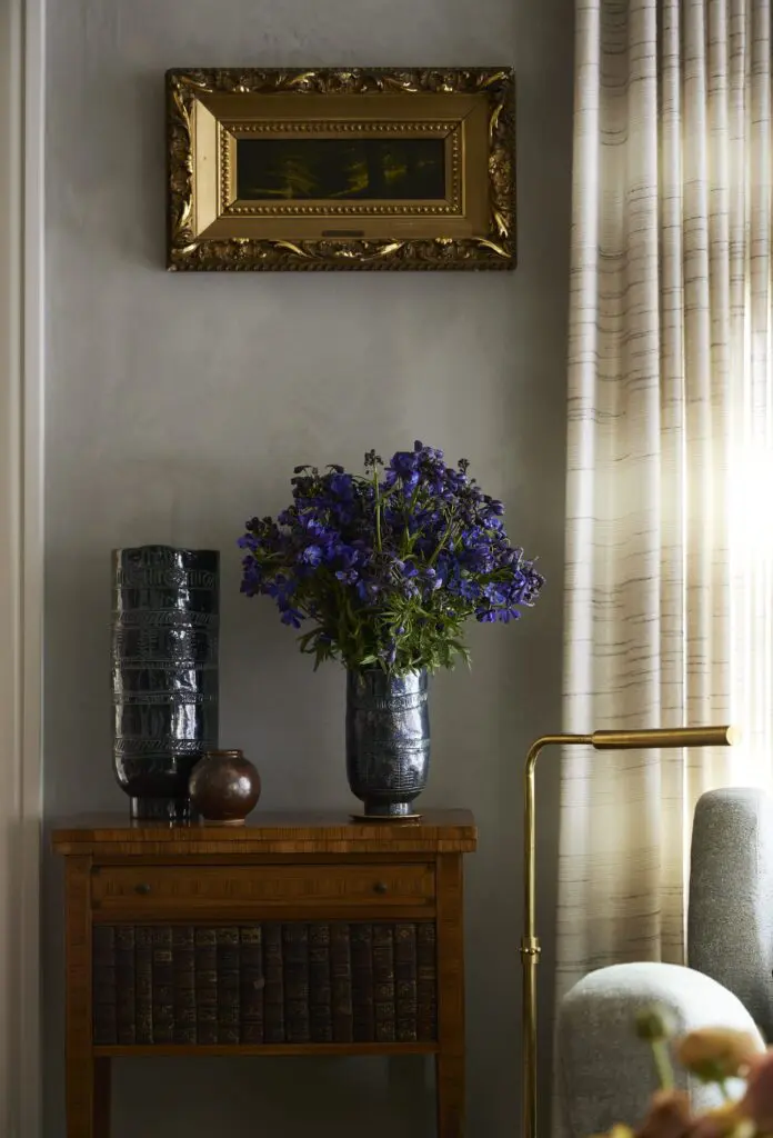 Antique table from Round Top and MOUS vase, left. Harvey Joiner landscape painting. (Photo by Kristopher Ellis)
