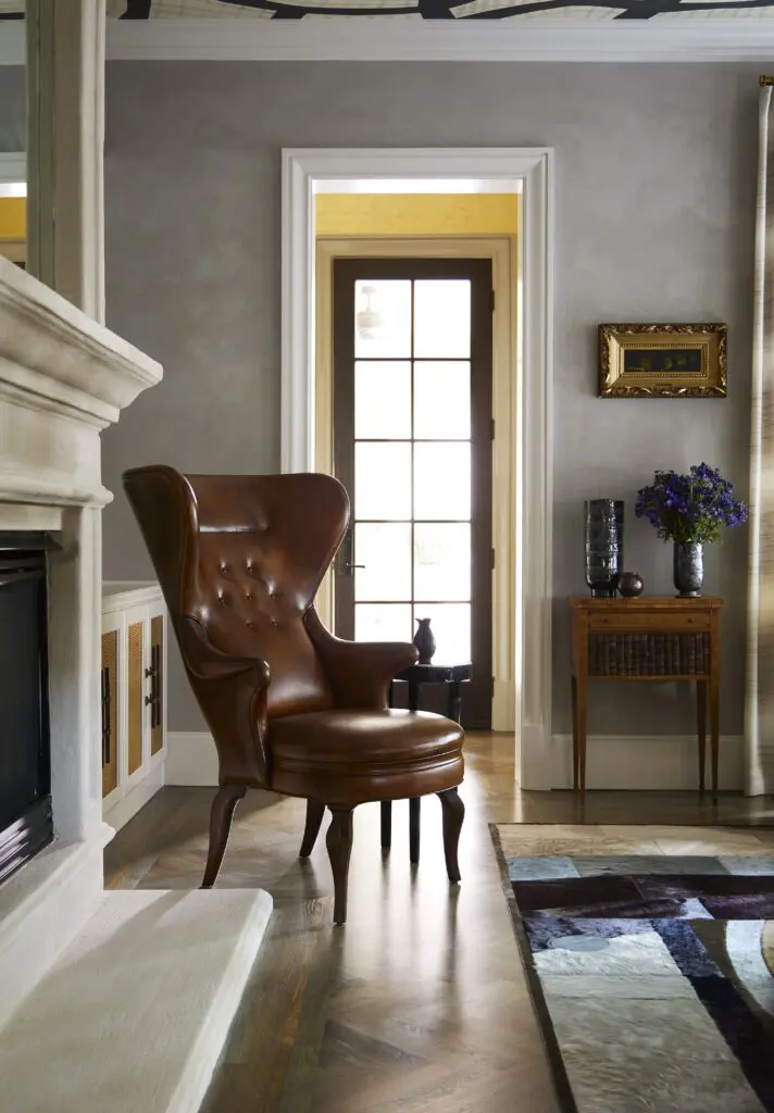 Leather wingback chair from Jean de Merry. Plaster wall finish by Chateau Domingue. (Photo by Kristopher Ellis)