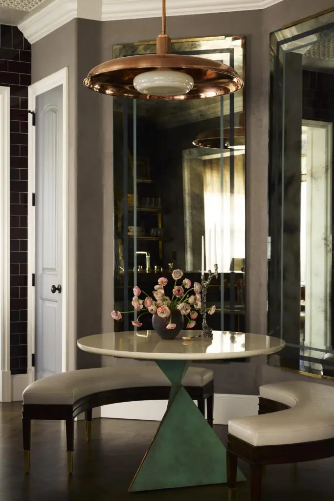 Moore designed the breakfast-room benches. Roman and Williams Guild light fixture. Tom Faulkner table base from David Sutherland Showroom. (Photo by Kristopher Ellis) 