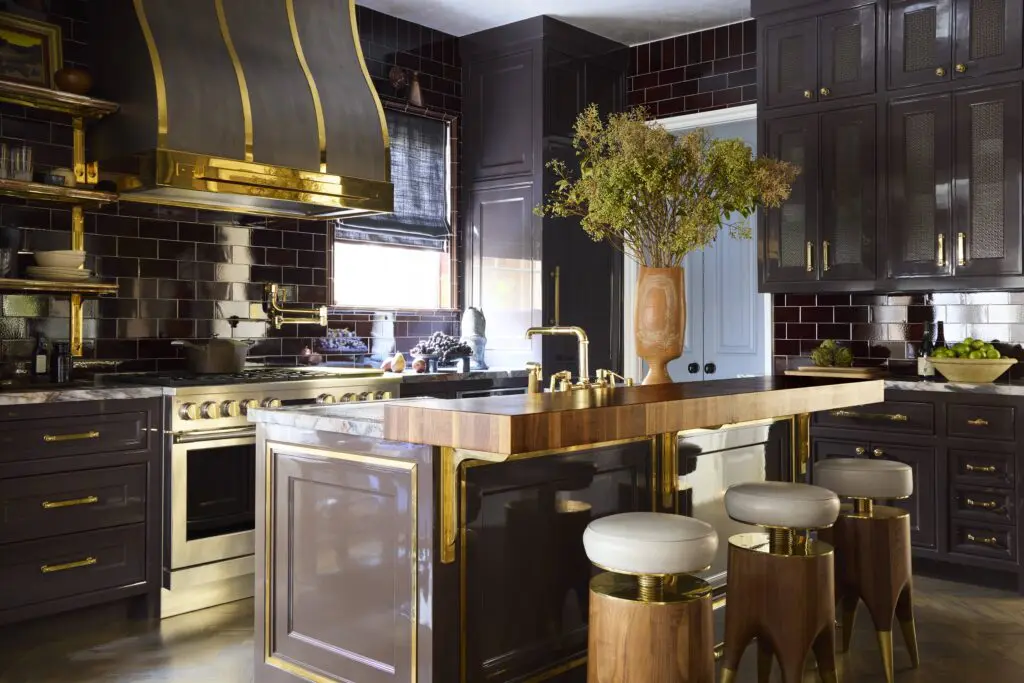 Moore designed the kitchen’s vent-hood cover, made by Raw Urth. Monogram Appliances oven and range. Waterworks tile and plumbing fixtures. Grothouse cutting board countertop with brass brackets designed by Moore, fabricated by Orona Metal. Blackman Cruz stools. (Photo by Kristopher Ellis)