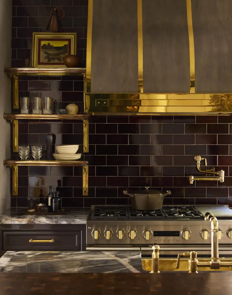 Custom brass shelves, designed by Moore, are plated in butler silver.  (Photo by Kristopher Ellis)