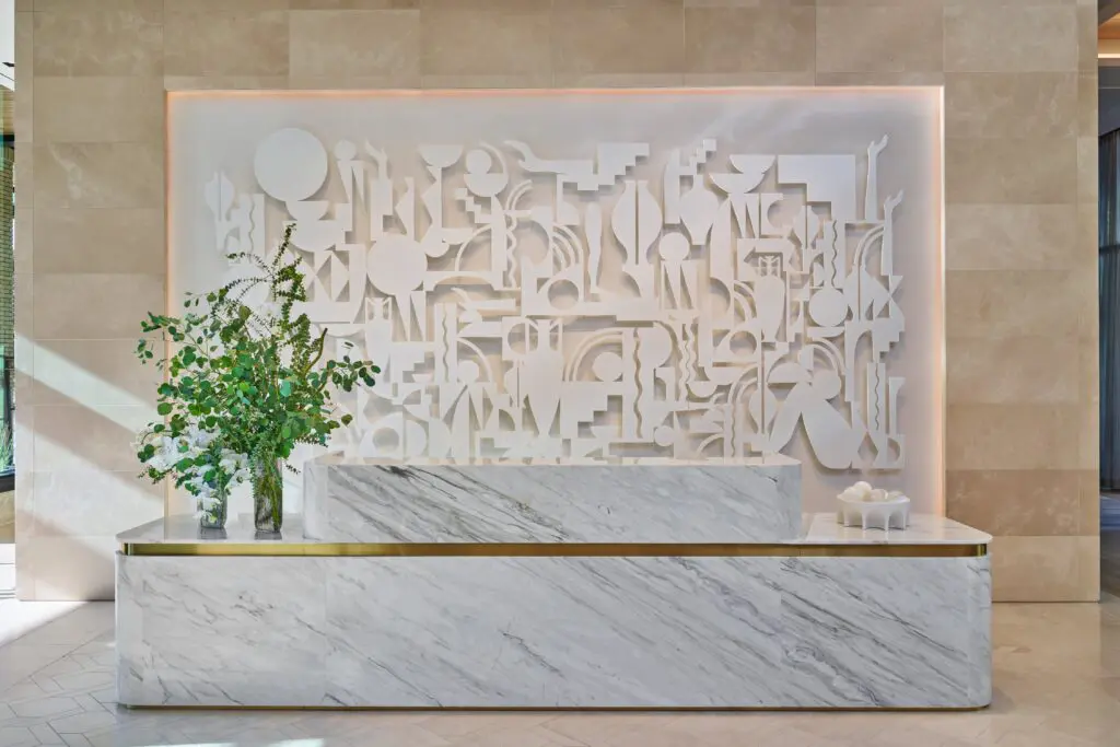 Reception desk with Carolyn Salas's "Figuring No. 4," 2022