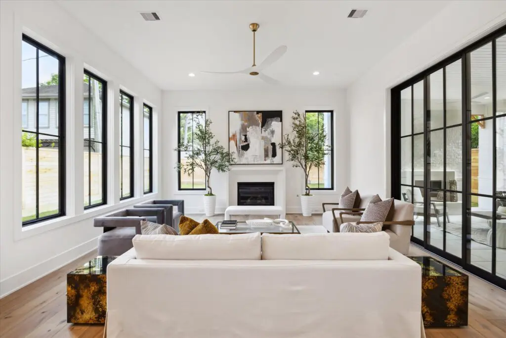 Twelve-foot ceilings and an abundance of windows were selling points of the home at 702 E. 19th Street (Photo by TK Images)