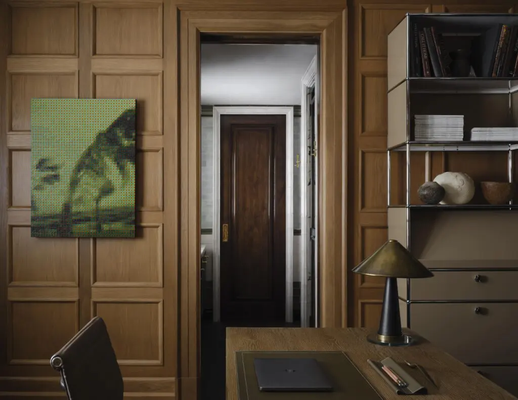 In Moore’s office, custom wall paneling and desk. Collier Webb lamp. A storage piece by USM Haller. Troika acrylic on canvas from OMR gallery, Mexico City. (Photo by Douglas Friedman)