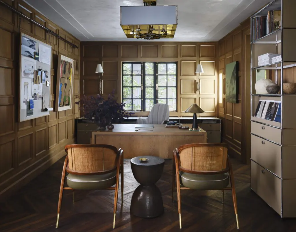 In Moore's office, vintage Edward Wormley chairs. Eric O’Leary ceramic table from Sputnik Modern. (Photo by Douglas Friedman)
