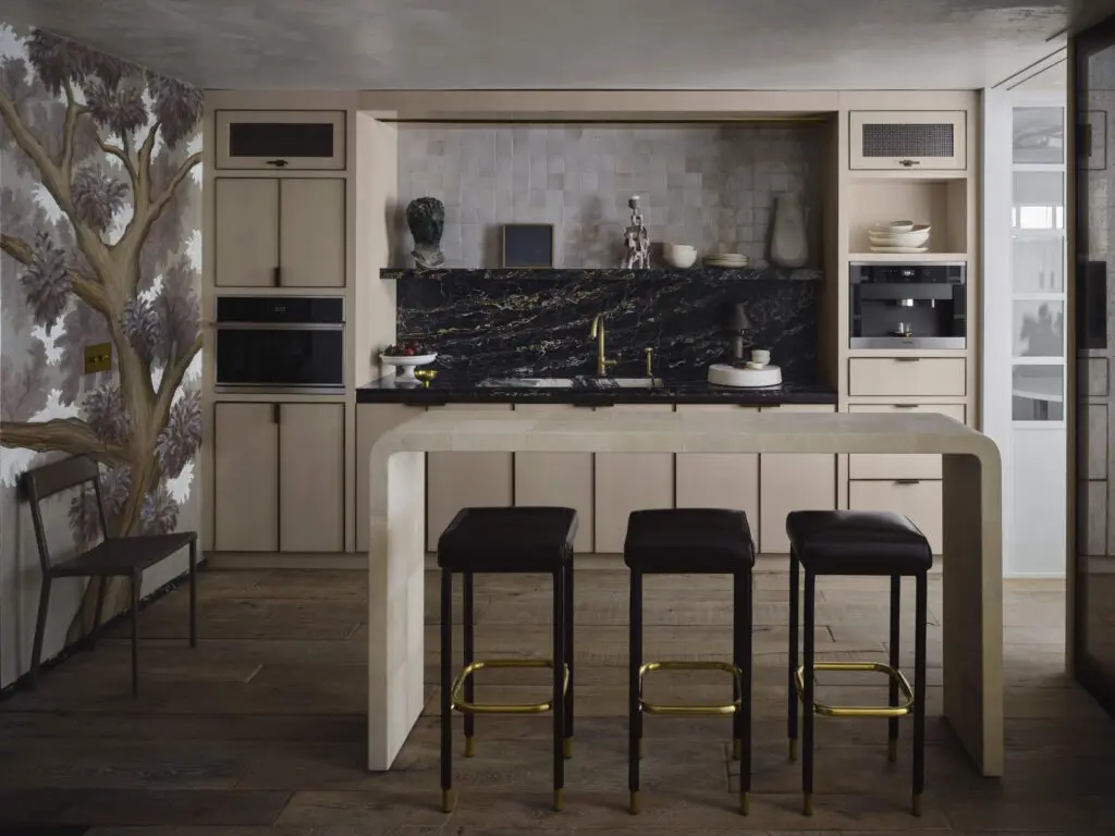 In the studio kitchen, live oak mural designed by Moore and painted on Gracie pewter-leaf ground paper by San Francisco decorative artist Caroline Lizarraga. (Photo by Douglas Friedman)