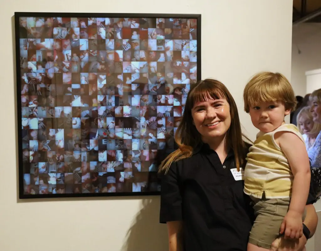 Maddie Casagranda stands near her "1:39 a.m." print, which won Honorable Mention in Archway Gallery's 17th Annual Juried Exhibition competition, juried by artist Rick Lowe. (Courtesy Archway Gallery, Houston)