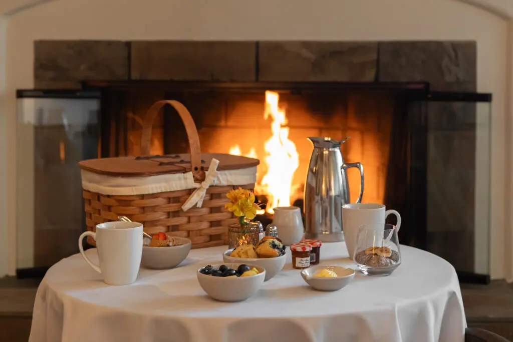 Guests of Casa Palmero enjoy a complimentary wellness breakfast fireside, with fresh juices, overnight oats, and flaky pastries delivered to your door.