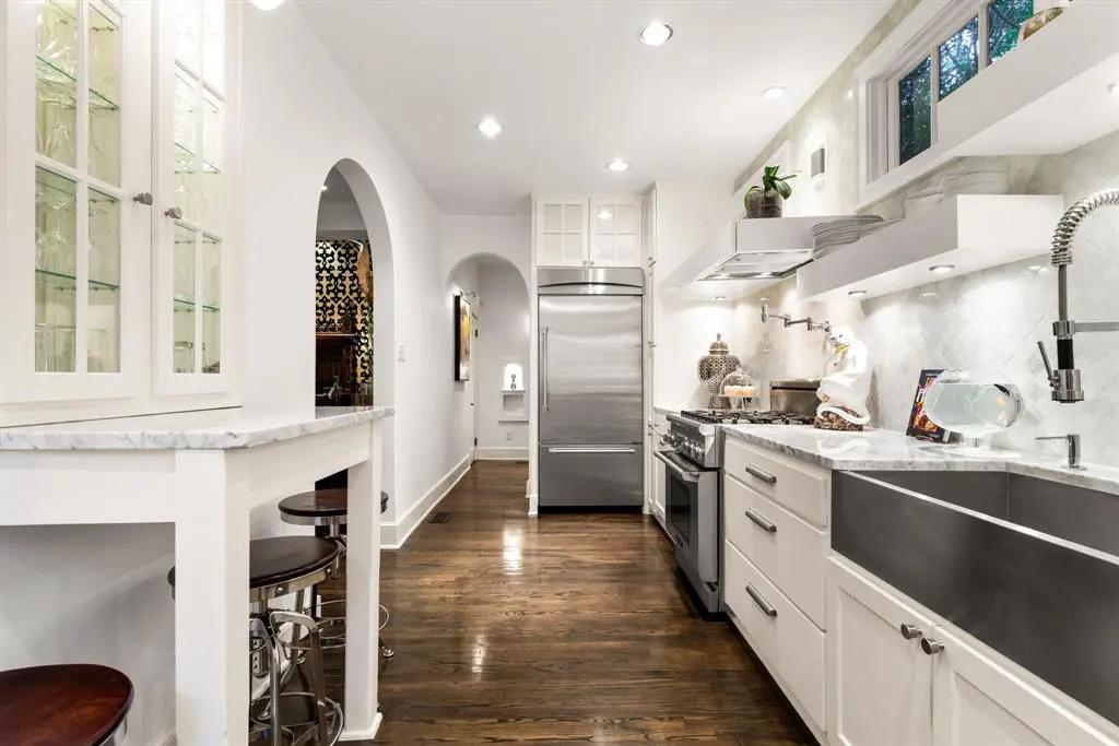Nestled on a cul-de-sac, the nearly-100-year-old home has been thoughtfully restored with modern living (& entertaining!) in mind. (Photo by Allie Beth Allman & Associates)