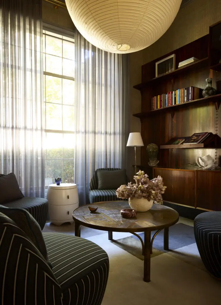 In the library, a massive 1960s rosewood bookshelf was discovered on 1stdibs. (Photo by Kristopher Ellis)