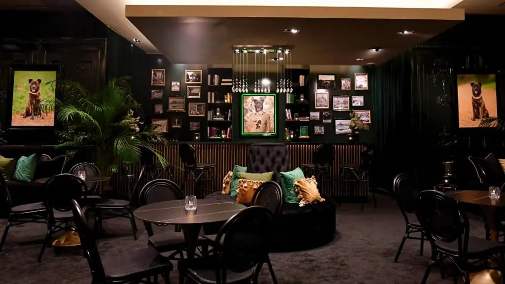 Multiple images of Blayne Fertitta's dog, Navi, decorate the speakeasy named in her honor (Photo Courtesy of the Post Oak Hotel)