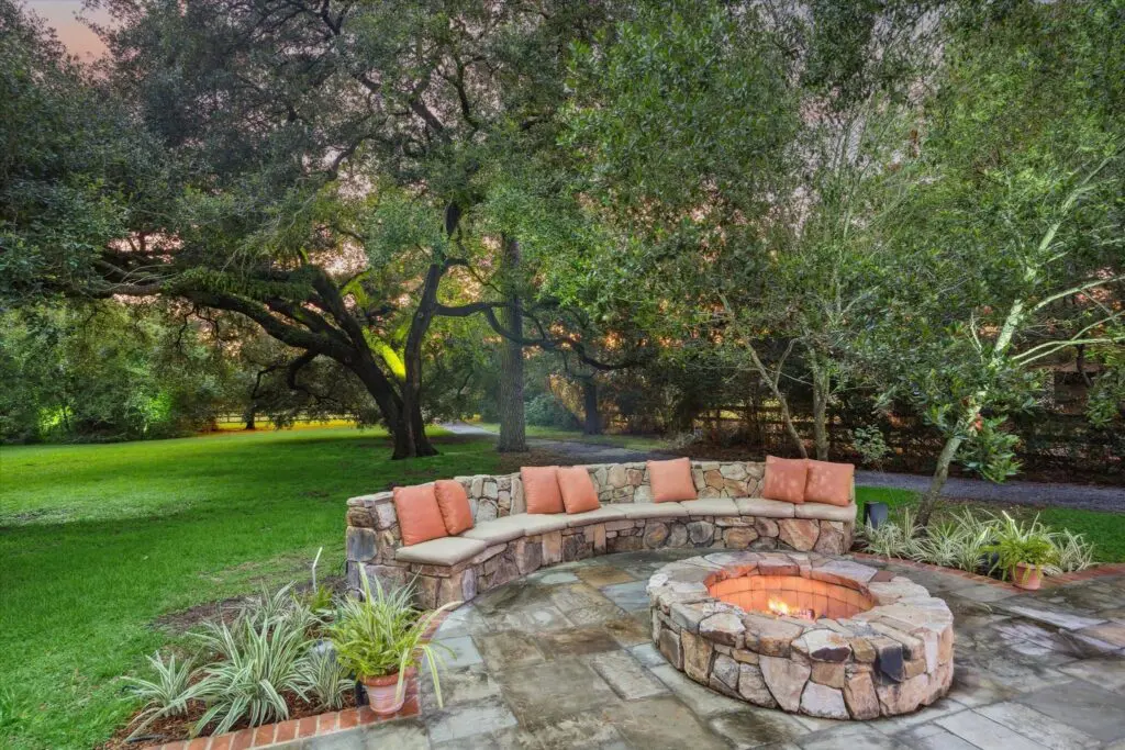 The all-stone fire pit and matching seating at 3 E Rivercrest Drive