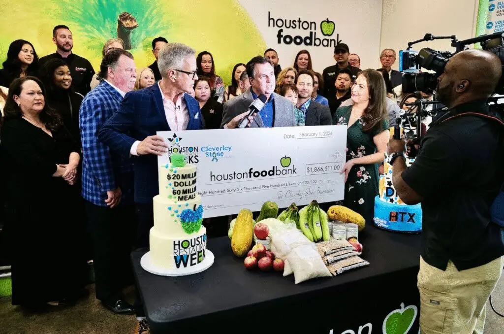 Houston Food Bank accepts a Houston Restaurant Weeks donation from the Cleverley Stone Foundation during a media event. (Photo courtesy Houston Restaurant Weeks)