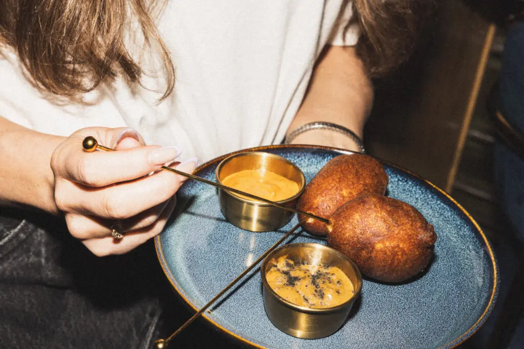 Apothecary is always coming up with innovative menus including its latest July 1990s-inspired one featuring an octopus corndog. (Photo by Samantha Marie)