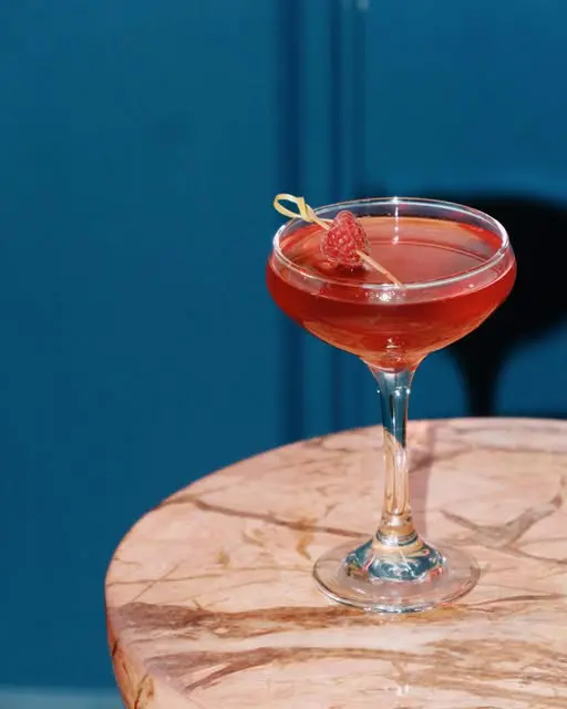 The Shania Twain cocktail at Sidesaddle Saloon blends Empress Gin, raspberry mint syrup, lemon, and Prosecco for a bold and bubbly sip. (Courtesy)