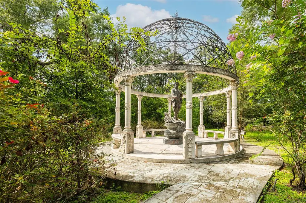 This elegant Italian marble gazebo makes a bold statement. 