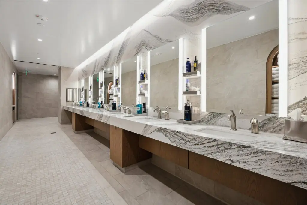 Light-filled locker areas, luxurious wet and dry vanities, lit mirrors, and elegant millwork make getting ready for work or a night out after your workout enjoyable. 