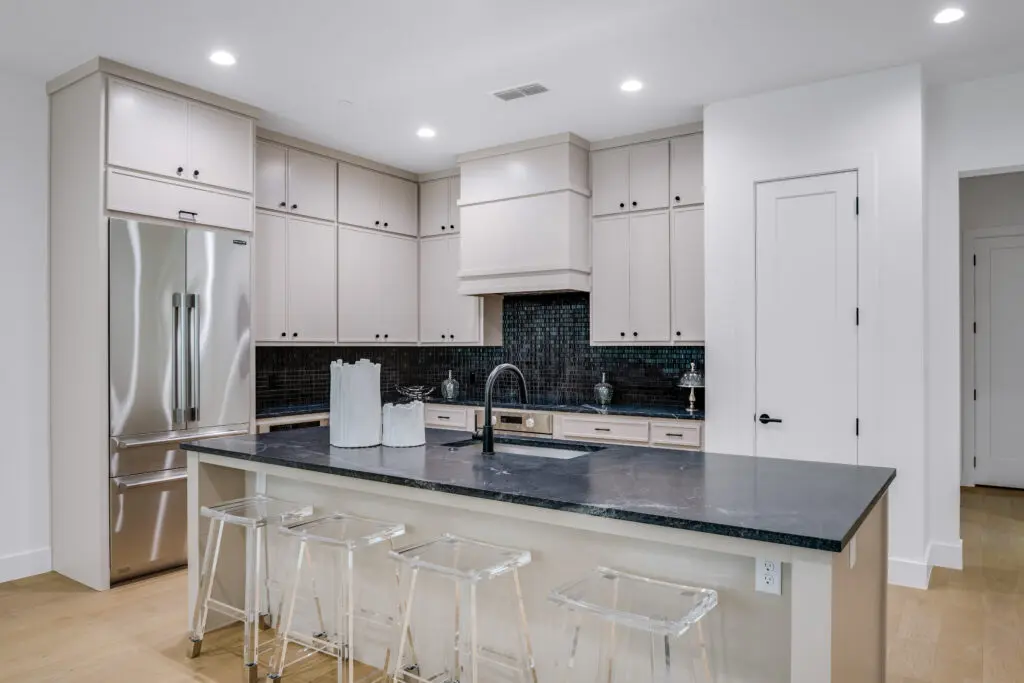 Each unit features an open-concept, eat-in kitchen appointed with sleek shaker cabinetry, luxe countertops, and a top-of-the-line suite of kitchen appliances. (Courtesy)