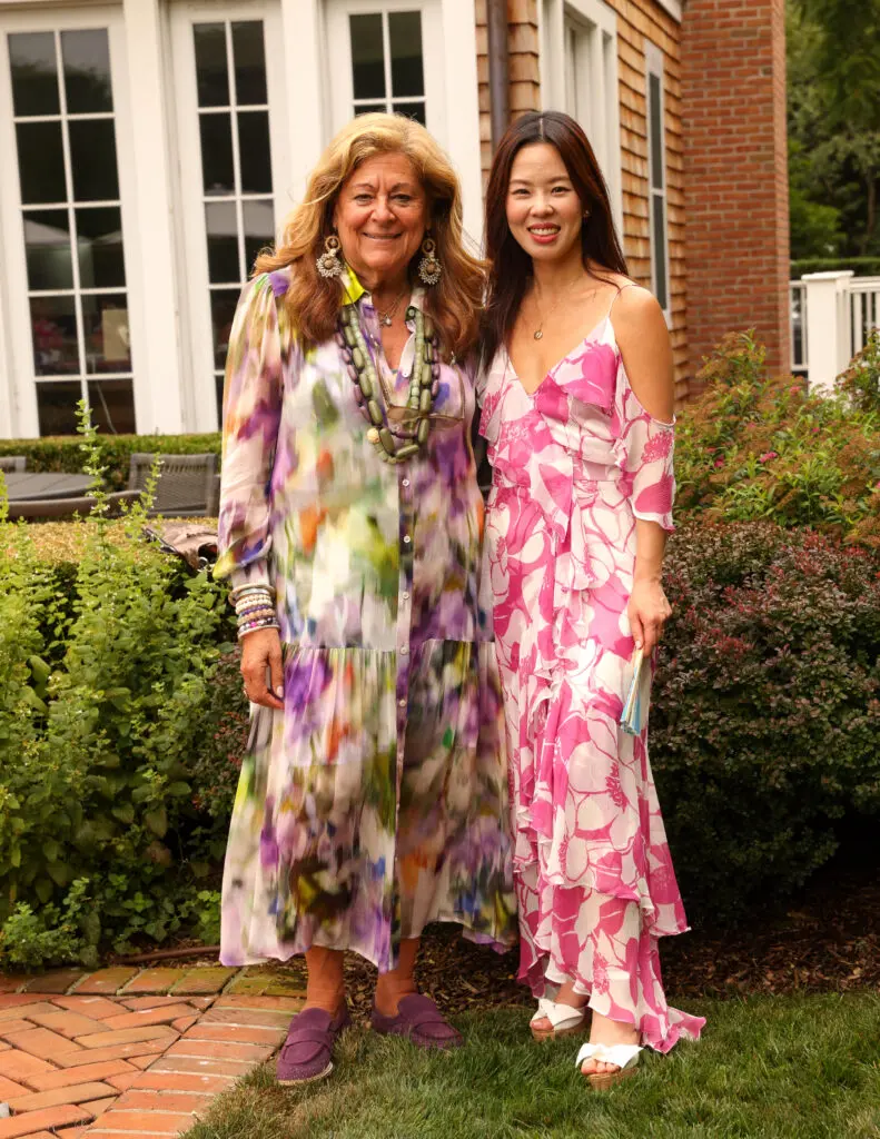 Fashion world innovator Fern Mallis, Christy Lynn Lee at the Christy Lynn poolside luncheon in Southampton (Photo by BFA / Kevin Czopek)