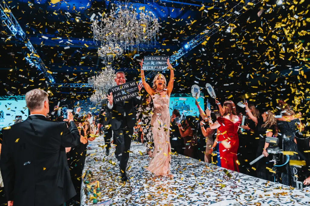 Bruce and Diane Kink leading the Runway Finale (Photo by Interfaith of The Woodlands)