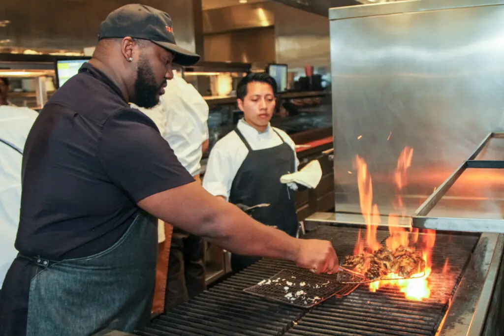 Houston's Top Chef winner Tristen Epps fires up the grill at Guard and Grace. (Photo by Charles Dante)