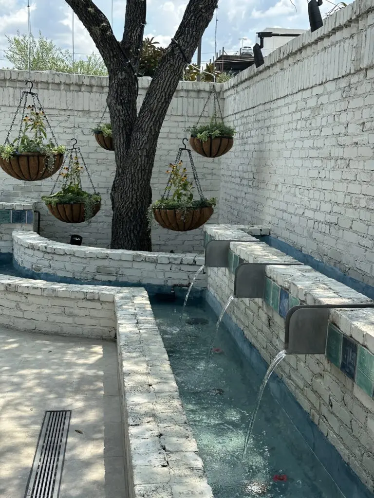 The outdoor dining area at Yiayia's Greek Kitchen is flanked by a girgling water feature. (Photo by Shelby Hodge)