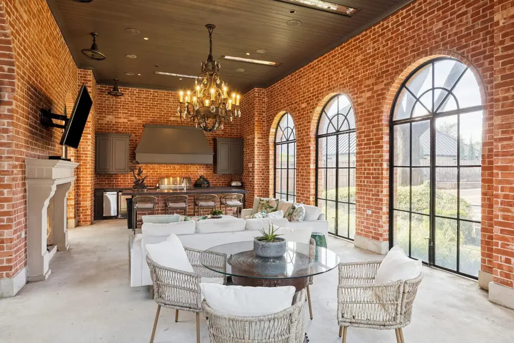 The cabana also provides remote screened living and dining areas with ceiling heaters, ensuring year-round entertaining and true indoor-outdoor living. (Photo by Allie Beth Allman & Associates)