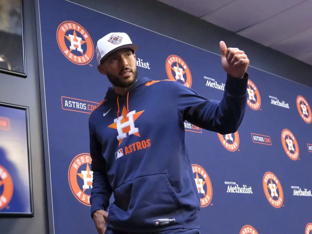 Carlos Correa is all thumbs up on his return to the Astros, living in Houston again and being back with Jose Altuve. (Photo by F. Carter Smith)