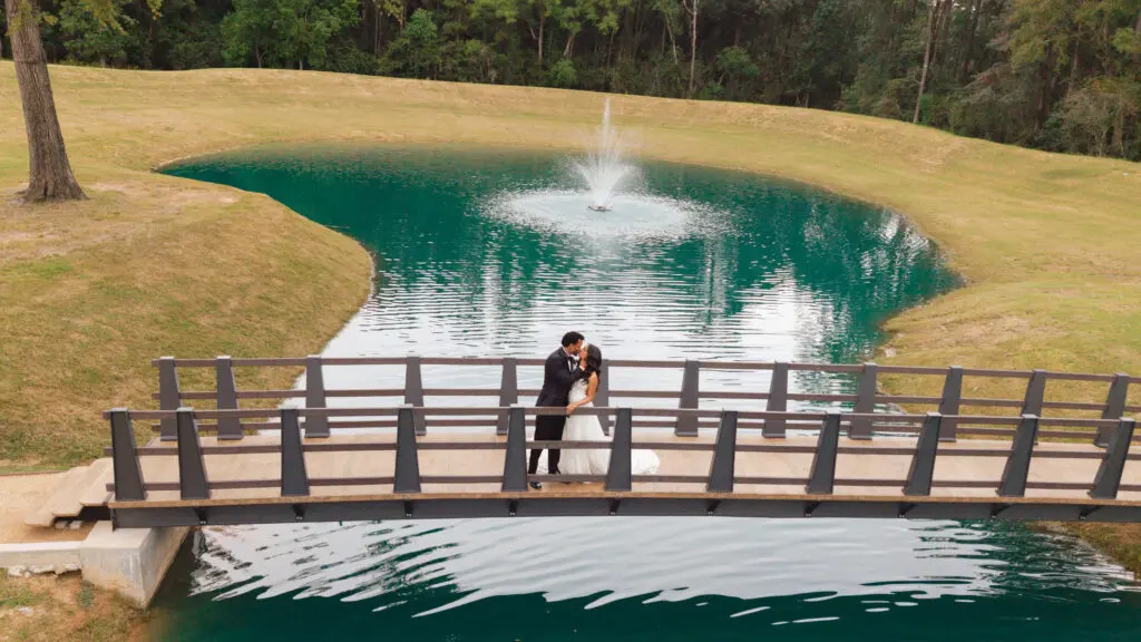 Aly Jacobs and Josh Harrell share a moment on The Forever Bridge" at The Blue Magnolia. (Photo by Leelo Shots)